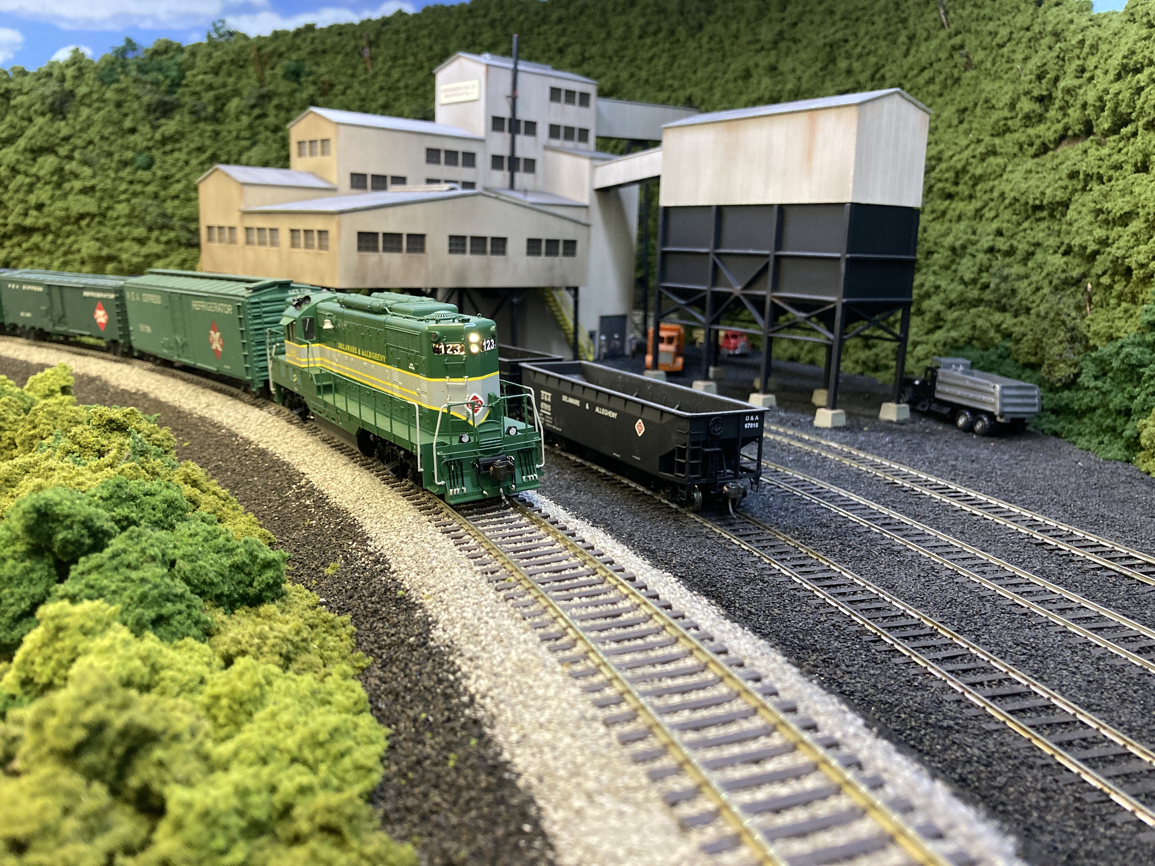 Photo 2 - The daily eastbound mail and express local P22, led by EMD GP7 123, passing Moshannon Coal Company Plant No. 11 at East Clearfield, PA.  Next stop will be Woodland, en route to DuBois, PA